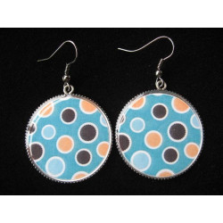 Earrings, brown and orange dots on a turquoise background, set in resin