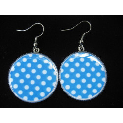 Fancy earrings, white dots on a blue background, set in resin