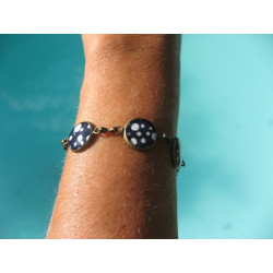 Small cabochons bracelet, small white dots on a black background