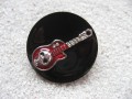 Large fancy ring, red guitar, on a black resin background