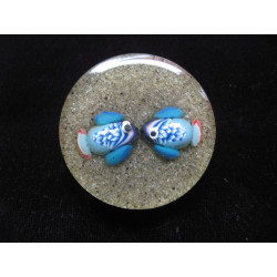 Big summer ring, tropical fish lovers, on a background of sand in resin