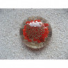 Very large cabochon ring, silver microbeads, on a red resin background