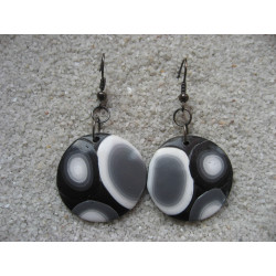 Graphic earrings, white and black patterns on a black background, in fimo