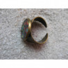 Small cabochon ring, multicolored polka dots on a black background