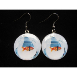 Small fancy earrings, fish or shark, set in resin