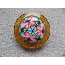 Large ring, psychedelic cabochon in fimo, on an orange resin background