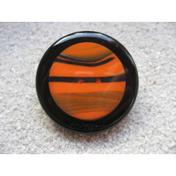 Very large ring, orange and black cabochon in fimo, on a black resin background