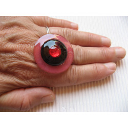 Large graphic ring, red pearl, on black and red resin background