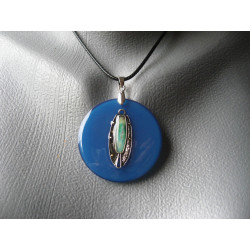 Graphic pendant, silver turquoise pearl charm, on blue resin background