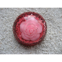Large cabochon ring, rose flower, on fuchsia resin background